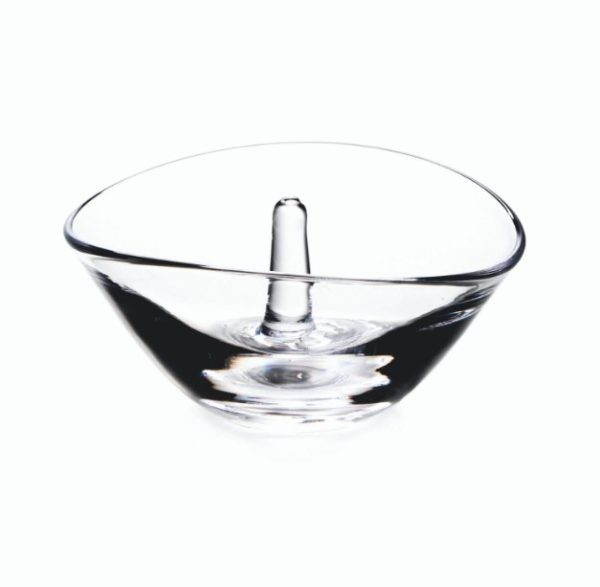 The Simon Pearce Champlain Ring Holder features a clear glass bowl with a central pillar rising elegantly from its base. The bowl has smooth, curved edges and is presented against a plain white background.