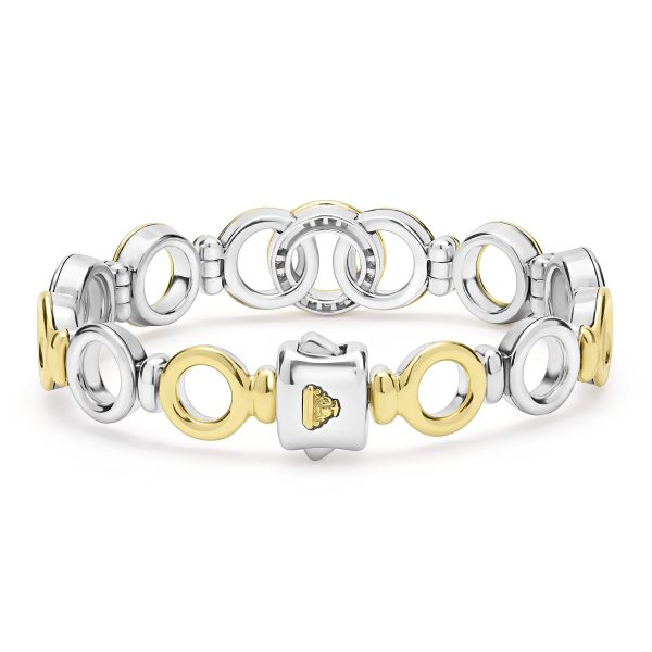 The LAGOS Signature Caviar Two-Tone Interlocking Diamond Link Bracelet showcases an elegant design with alternating gold and silver circular links, highlighted by a central gold triangular embellishment. This stylish bracelet blends modern design elements, making it perfect for accessorizing various outfits.