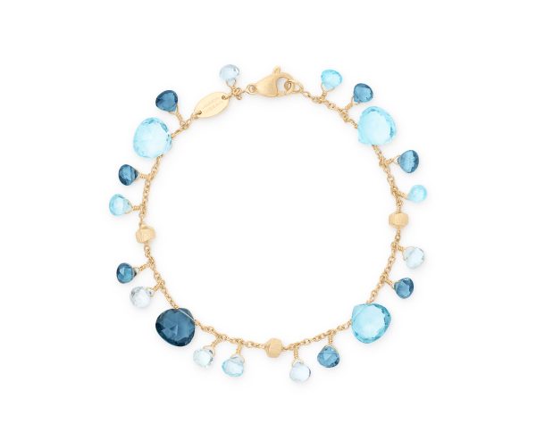 The Marco Bicego Paradise Mixed Topaz Single-Strand Bracelet features a delicate gold chain adorned with blue and turquoise gemstones of various shapes and sizes. The stones are evenly interspersed along the chain, creating a colorful and elegant design.