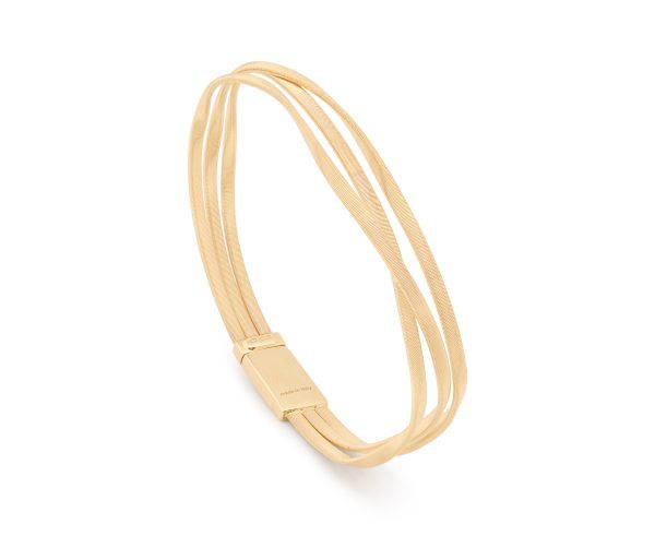 Introducing the Marco Bicego Marrakech 3 Strand Coil Bracelet: a sleek accessory featuring three parallel bands seamlessly joined at a rectangular connector. This minimalist design exudes elegance with its smooth, polished finish.