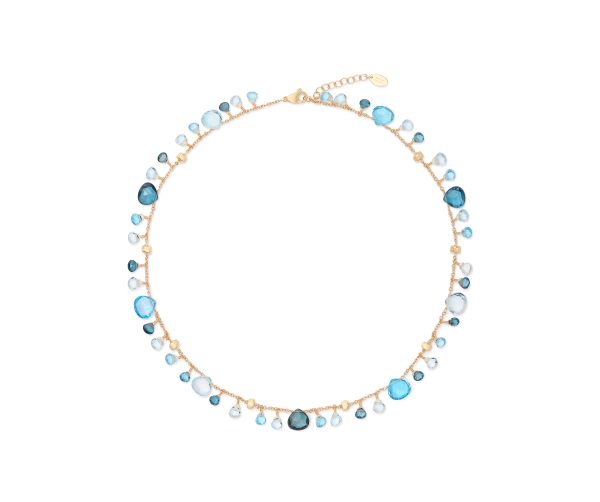 The Marco Bicego Paradise Mixed Topaz Single-Strand Necklace is a delicate gold piece featuring blue topaz gemstones in various shades and sizes, symmetrically arranged along the chain. The combination of light blue and teal hues gives it a vibrant yet elegant appearance.