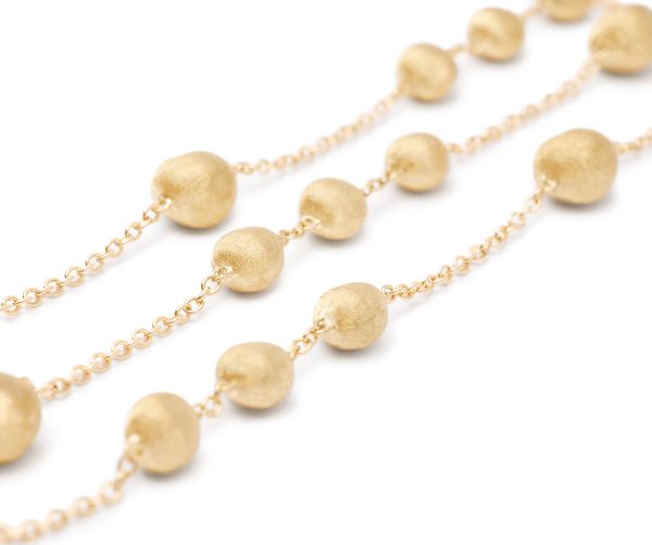 Close-up of the Marco Bicego Yellow Gold Station Bead Necklace showcasing round, textured beads connected by delicate chains, displayed against a white background.