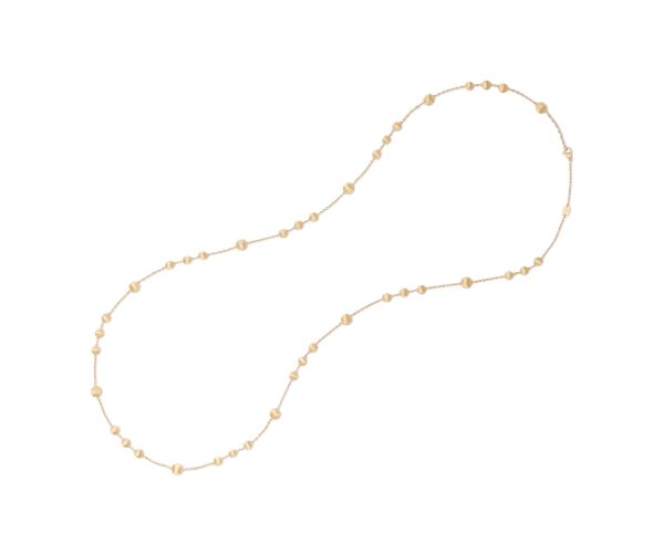 The Marco Bicego Africa Yellow Gold Bead Necklace features a delicate gold chain with small beads evenly spaced along its length, elegantly arranged in an elongated oval shape on a white background.