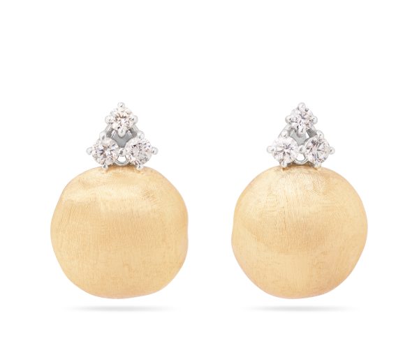 The Marco Bicego Africa Yellow Gold Stud Earrings showcase an elegant design with textured gold spheres, adorned with three small, sparkling diamonds arranged in a triangle pattern above each sphere, set against a plain white background.