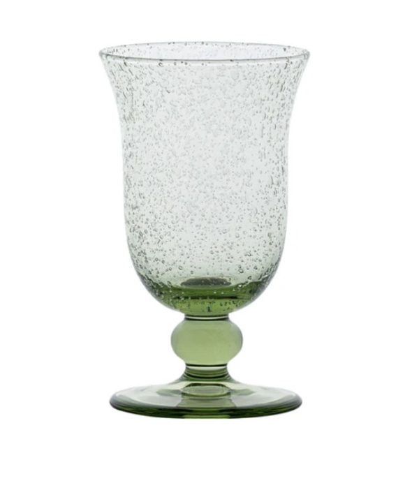 The Juliska Provence Goblet - Basil features a textured green design with a wide rim and a rounded base supported by a circular foot. Its speckled appearance adds a decorative touch to the transparent material.