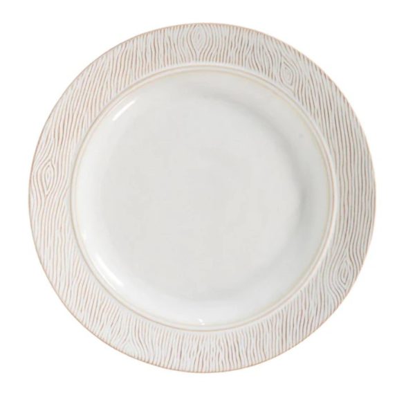 The Juliska Blenheim Oak Dinner Plate in Whitewash is a round, white ceramic plate with a textured, light beige rim featuring a wood grain pattern design. It is centered against a white background.