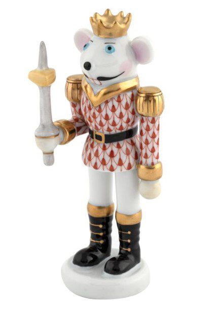 Introducing the Herend Mouse King Nutcracker Figurine - Rust: a beautifully crafted porcelain mouse figurine adorned with a gold crown, dressed in a detailed red and white patterned outfit with black boots, and holding a silver sword. It stands proudly on a white base and is enhanced with exquisite gold accents on its attire.