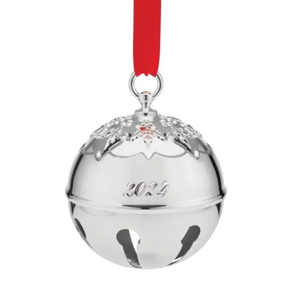 The Reed and Barton 2024 Holly Bell Ornament is a radiant silver Christmas bell engraved with "2024," featuring holly designs on top and suspended from a red ribbon.