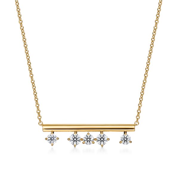 The Hearts on Fire Barre Floating Diamond Pendant Necklace features a gold bar pendant adorned with five evenly spaced shimmering diamonds, all elegantly suspended from a delicate chain.