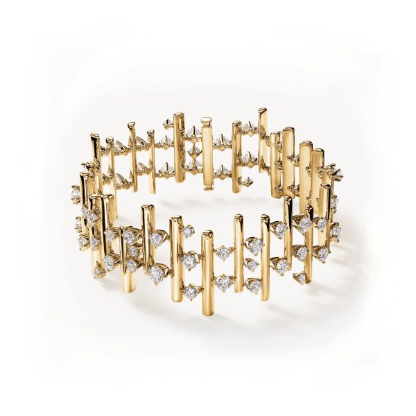 The Hearts on Fire Barre Multi-Row Bracelet is a gold bracelet featuring a geometric design with vertical bars linked by small, diamond-encrusted crossbars, creating an intricate lattice pattern.