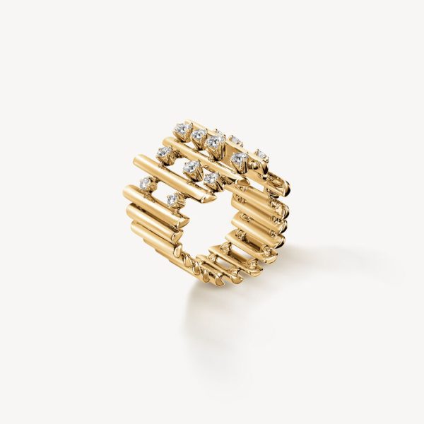 The Hearts on Fire Barre Multi-Row Diamond Ring features a gold design with parallel cylindrical bands, each adorned with small round diamonds, creating a geometric and modern look. The ring is beautifully showcased against a plain, light background.