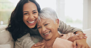 A daughter embraces her mom after giving her a Mother’s Day gift from Bromberg’s in Birmingham, AL.