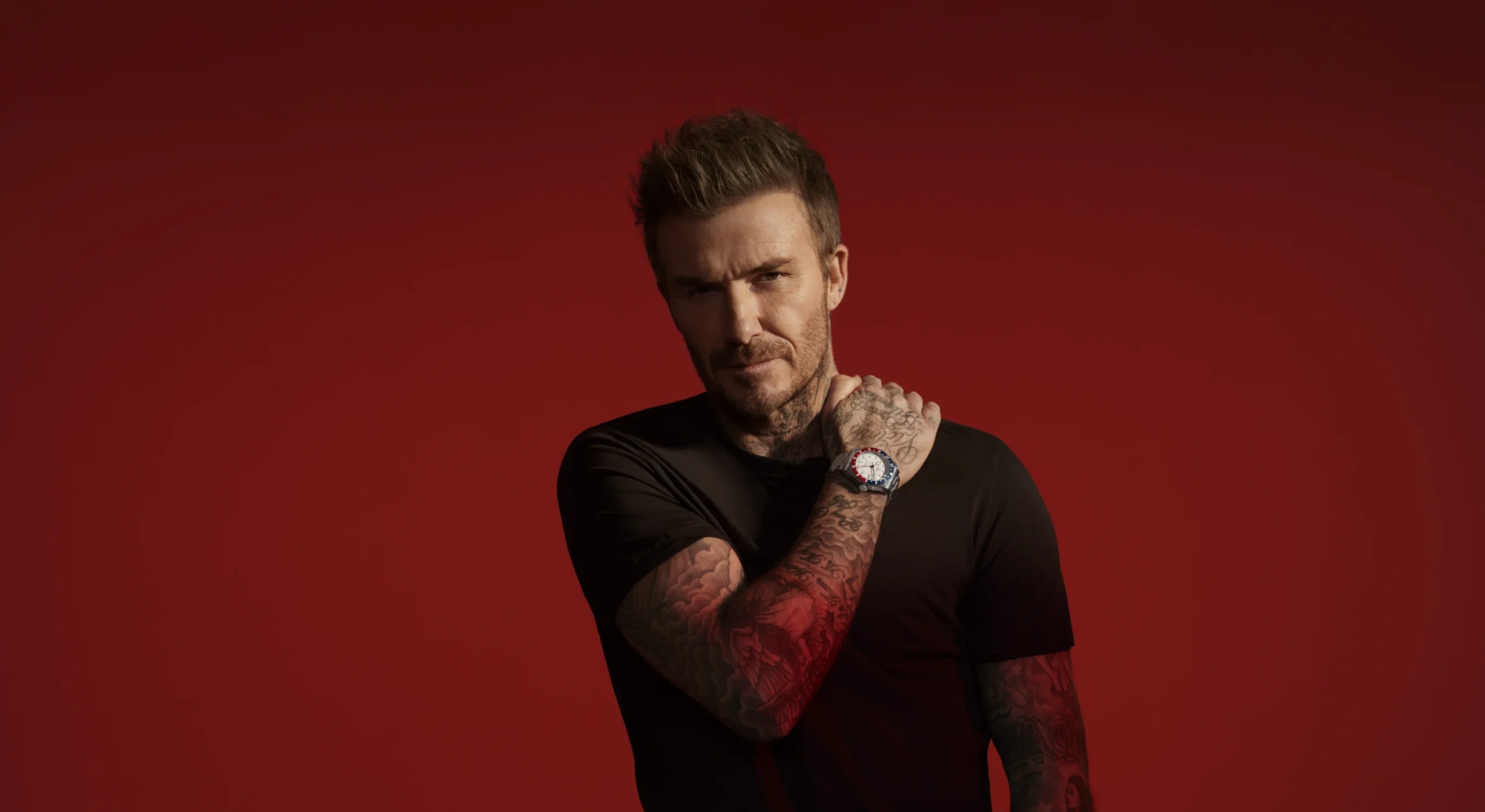 TUDOR Ambassador David Beckham on a red background