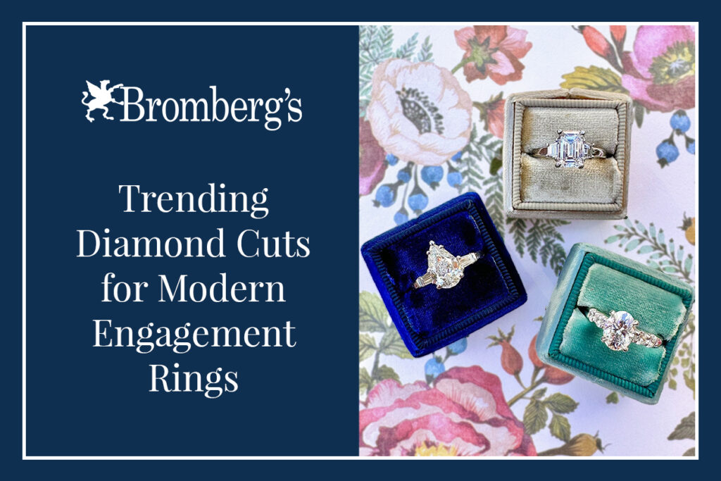 Velvet ring boxes with emerald, pear, and oval diamonds on floral paper, showcasing trending engagement ring cuts.